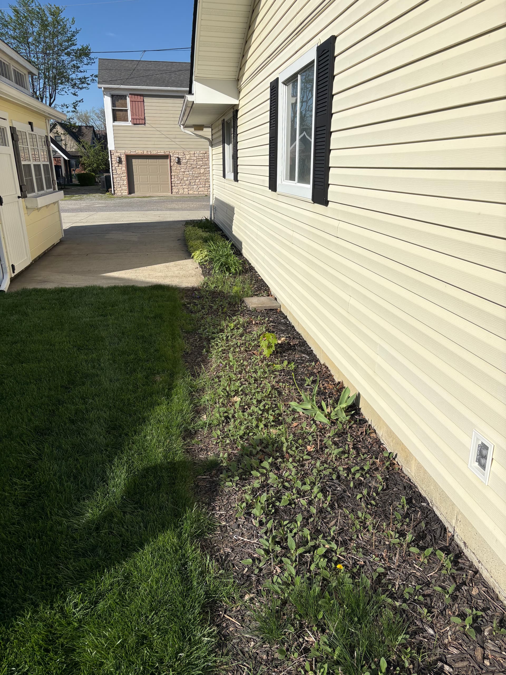 Lake Property Bed Cleanup Mulch and River Rock Done Right image